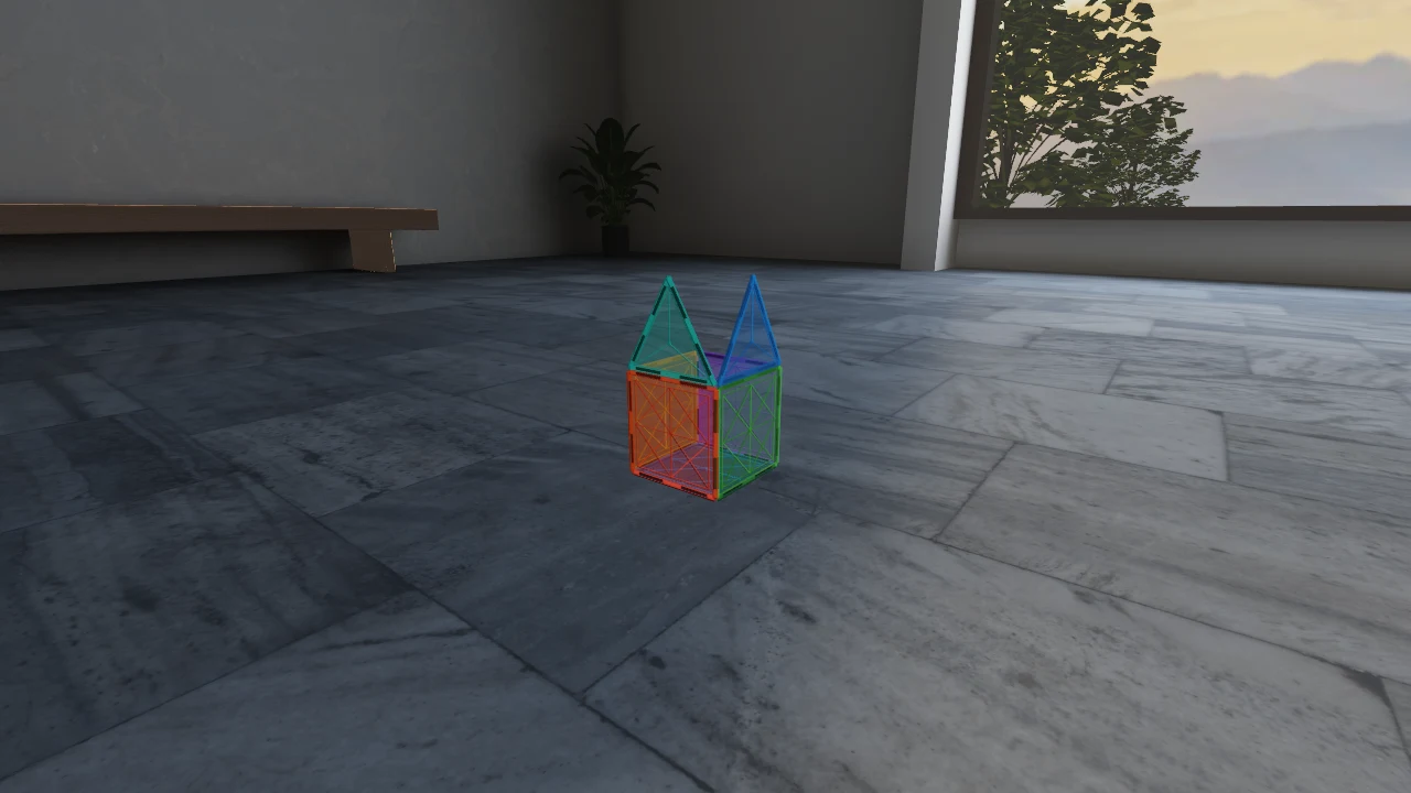 A small colourful house assembled from transparent square and triangular magnetic tiles.